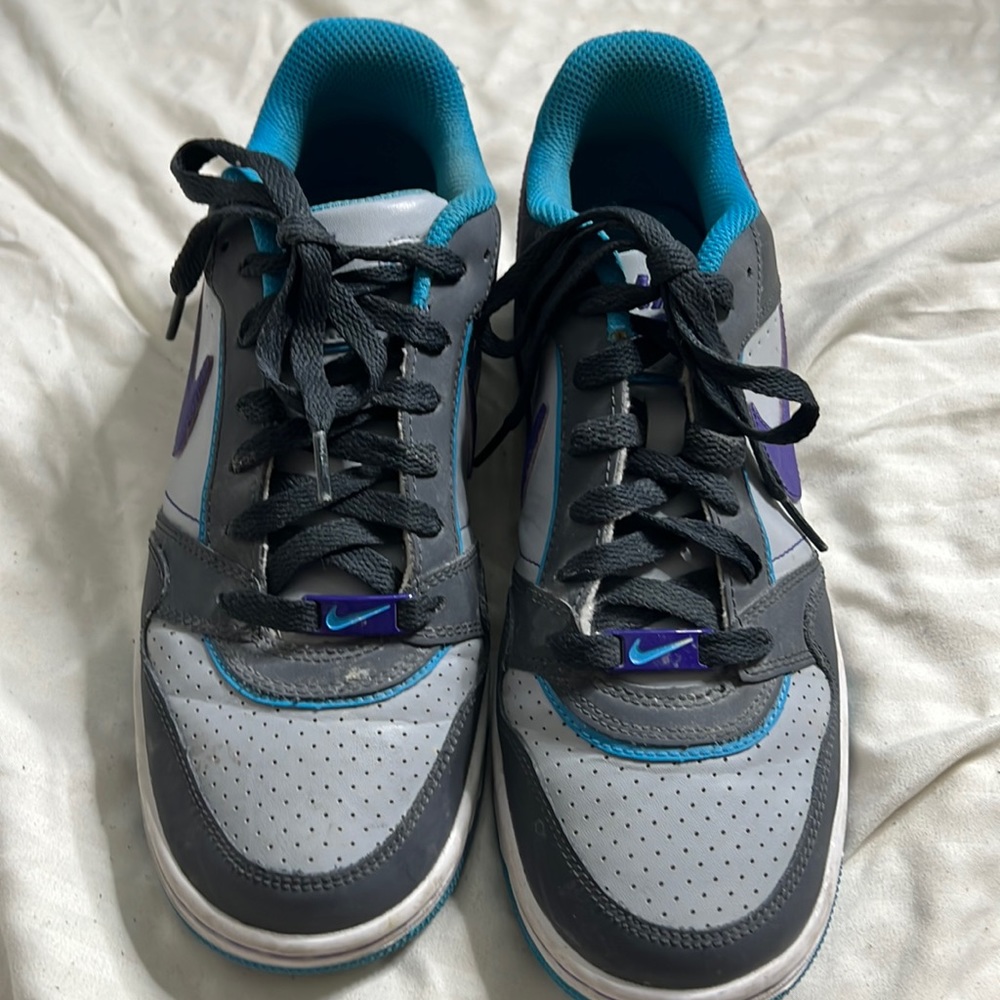 Purple, gray and turquoise Nikes